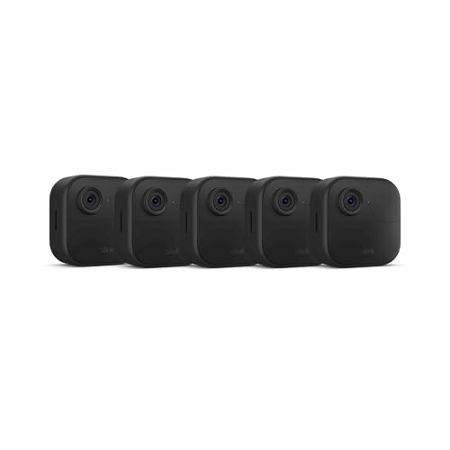 Set of five black security cameras in a row.