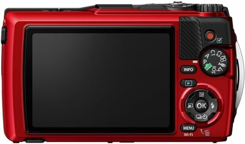 Back view of a red digital camera with various control buttons and a screen.